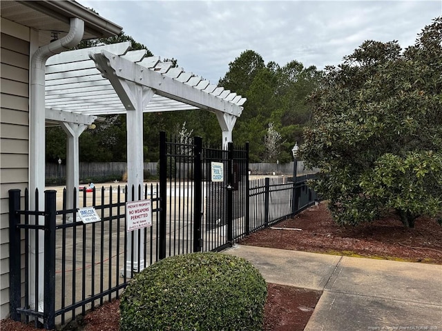 view of patio / terrace with a gate, a pergola, and fence