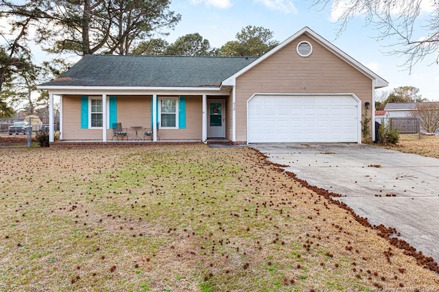 single story home with a front yard, an attached garage, fence, and driveway