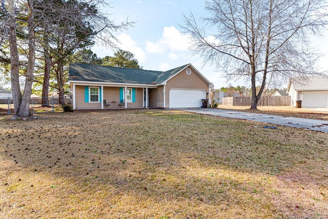 single story home with covered porch, driveway, a garage, and fence