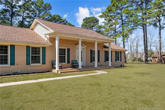 1284 Old Stage Rd, Fairmont, NC 28340 - view of front of property with brick siding, covered porch, a front yard, and roof with shingles