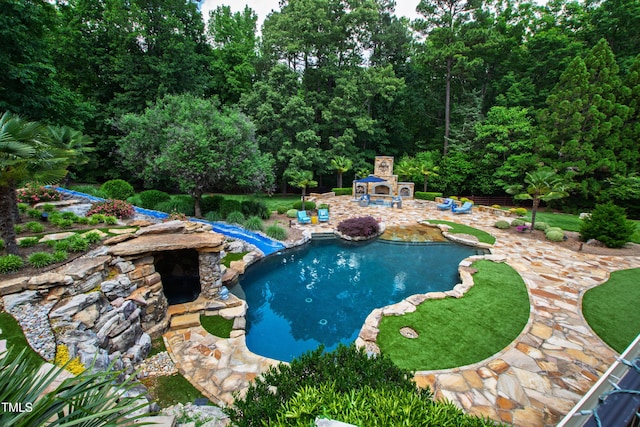 2421 Acanthus Dr, Wake Forest, NC 27587 - outdoor pool with a fireplace and a patio area