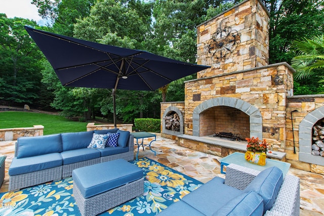 2421 Acanthus Dr, Wake Forest, NC 27587 - view of patio featuring an outdoor living space with a fireplace and view of wooded area