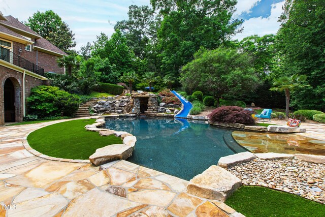 2421 Acanthus Dr, Wake Forest, NC 27587 - swimming pool featuring a water slide and a patio area