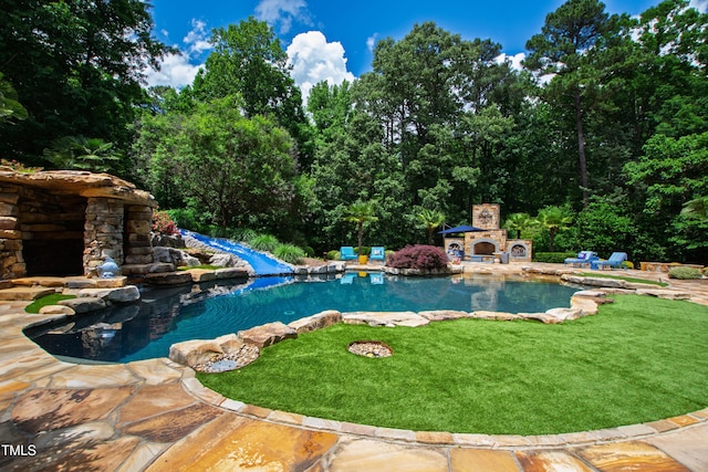 2421 Acanthus Dr, Wake Forest, NC 27587 - swimming pool featuring an outdoor stone fireplace, a patio, and a yard
