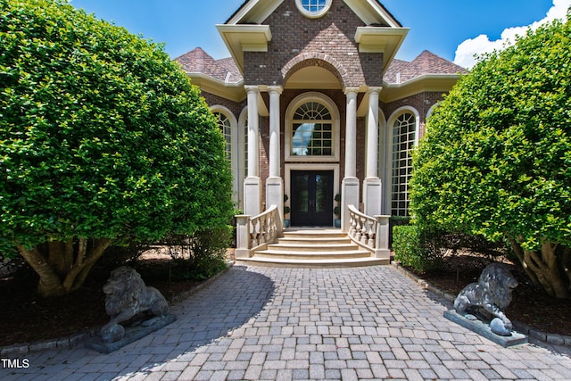2421 Acanthus Dr, Wake Forest, NC 27587 - doorway to property featuring brick siding