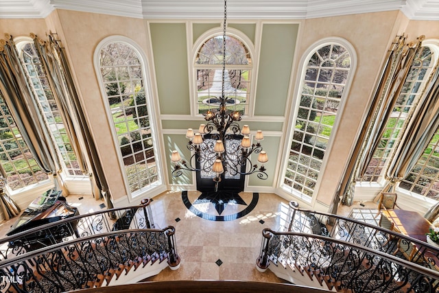 2421 Acanthus Dr, Wake Forest, NC 27587 - detailed view of a chandelier, a decorative wall, and crown molding
