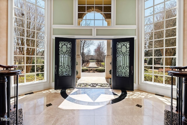 2421 Acanthus Dr, Wake Forest, NC 27587 - tiled entryway featuring inlaid floor details and baseboards