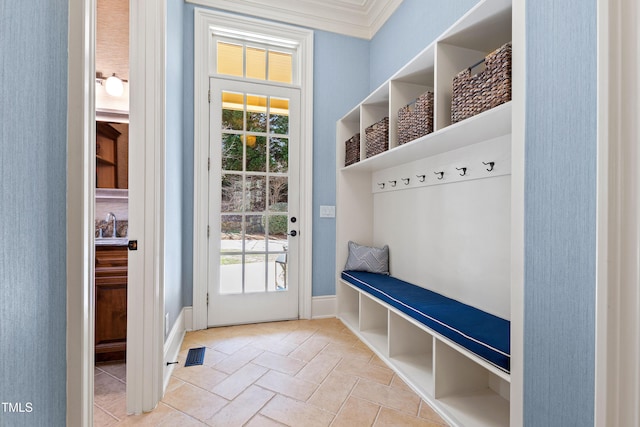 2421 Acanthus Dr, Wake Forest, NC 27587 - mudroom featuring healthy amount of natural light, crown molding, baseboards, and a sink