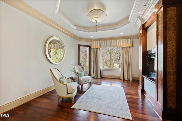 2421 Acanthus Dr, Wake Forest, NC 27587 - sitting room with dark wood finished floors, a tray ceiling, baseboards, and ornamental molding