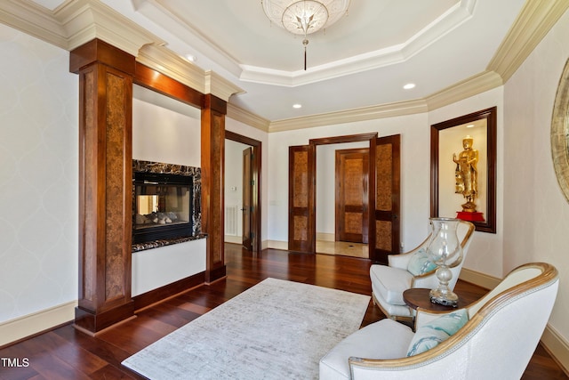 2421 Acanthus Dr, Wake Forest, NC 27587 - sitting room featuring dark wood-style flooring, a high end fireplace, baseboards, ornamental molding, and a tray ceiling