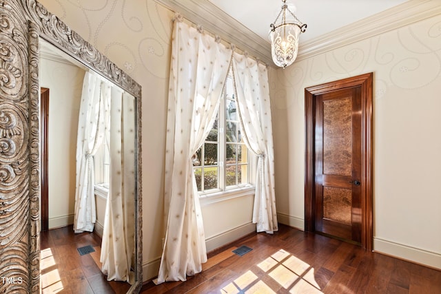 2421 Acanthus Dr, Wake Forest, NC 27587 - interior space with dark wood-style flooring, ornamental molding, baseboards, and a chandelier