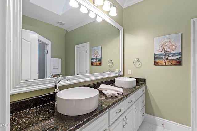 2421 Acanthus Dr, Wake Forest, NC 27587 - full bathroom with double vanity, a skylight, baseboards, and crown molding
