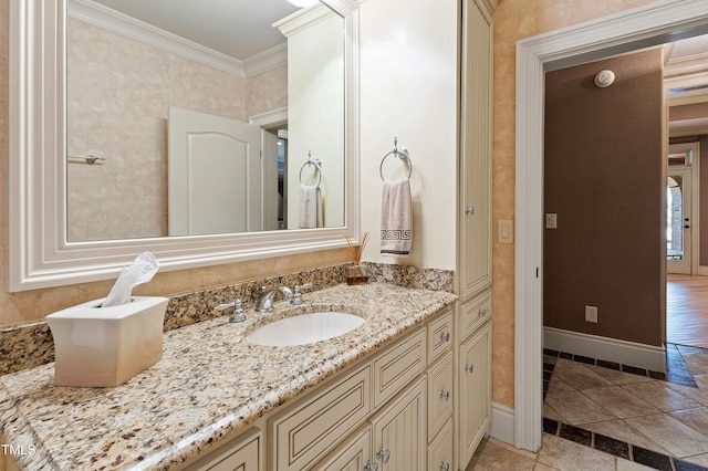 2421 Acanthus Dr, Wake Forest, NC 27587 - bathroom with crown molding, vanity, and baseboards