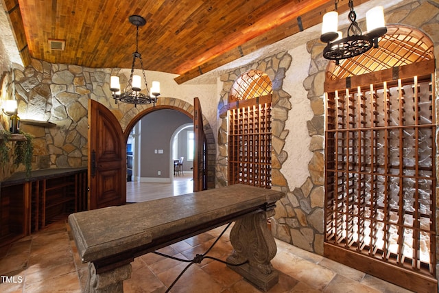 2421 Acanthus Dr, Wake Forest, NC 27587 - wine area with a chandelier, wood ceiling, and arched walkways