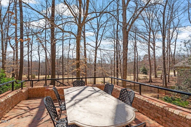 wooden terrace with outdoor dining area