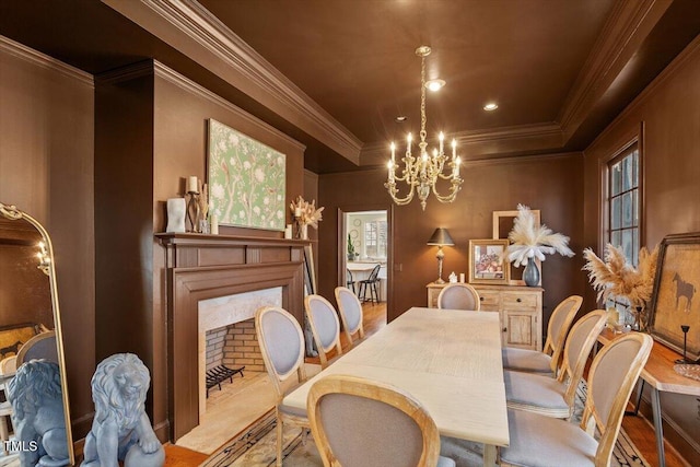 dining area featuring crown molding and a chandelier