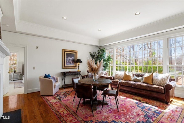 dining area with recessed lighting, baseboards, wood finished floors, and crown molding