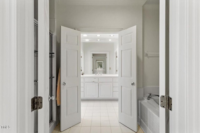 full bathroom with tile patterned floors, vanity, and a bath