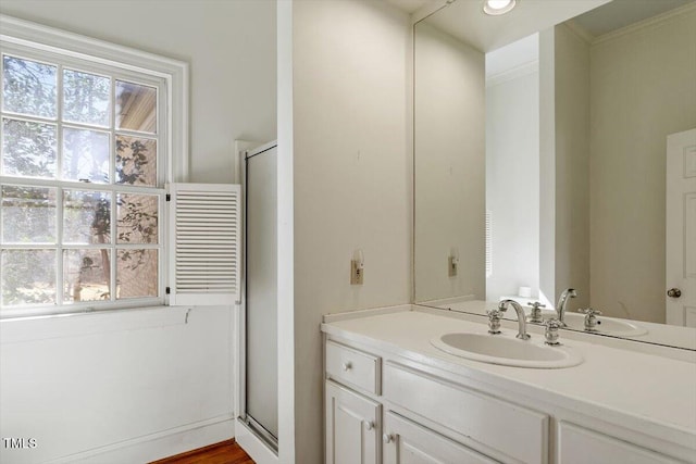 full bath featuring recessed lighting, a stall shower, vanity, and ornamental molding