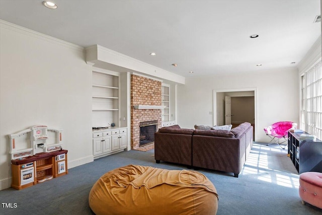 living area featuring carpet, crown molding, built in shelves, and a fireplace