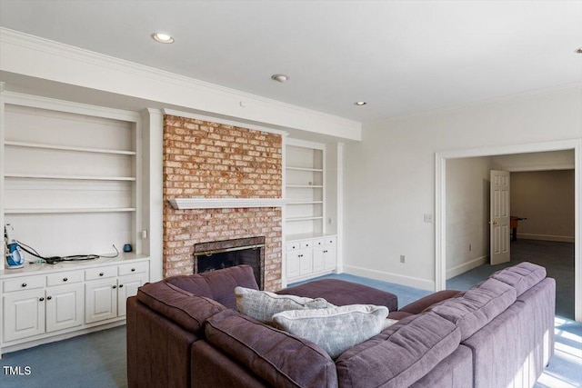 living area with built in shelves, crown molding, baseboards, dark carpet, and a fireplace