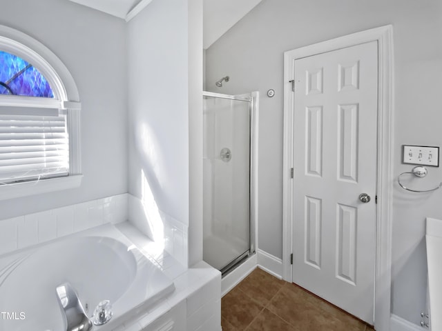 full bathroom with tile patterned floors, a garden tub, and a stall shower