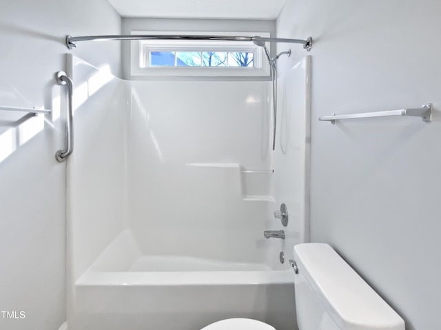 bathroom featuring toilet and shower / washtub combination