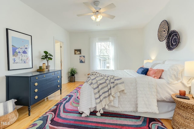 bedroom featuring a ceiling fan and light wood finished floors