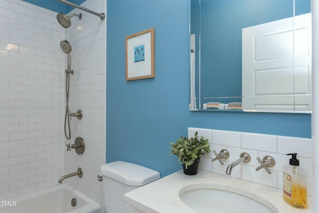 full bath featuring decorative backsplash, toilet, vanity, and shower / bath combination