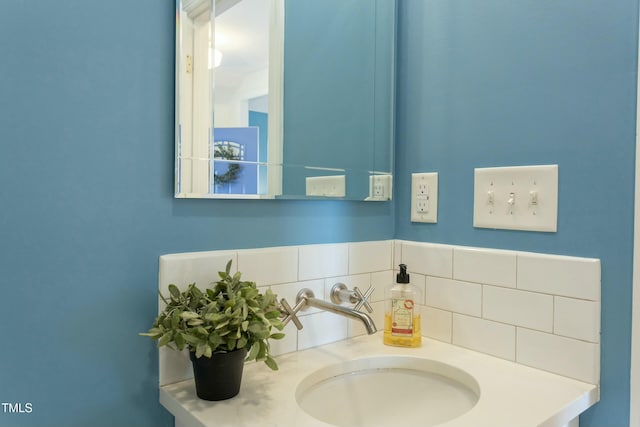 bathroom featuring backsplash and vanity