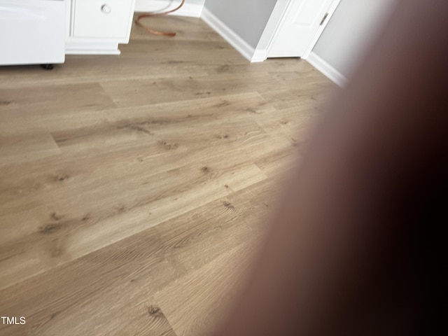 room details featuring wood finished floors and baseboards