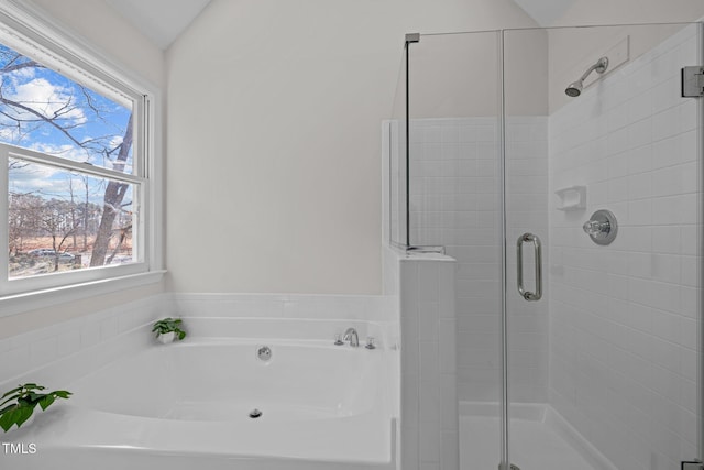 full bathroom with a garden tub and a stall shower