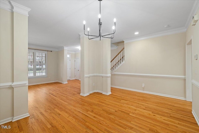 unfurnished dining area with stairway, crown molding, baseboards, and wood finished floors