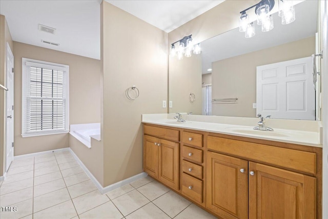 bathroom featuring a sink, a garden tub, double vanity, and tile patterned flooring