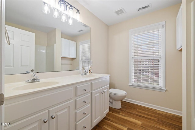 full bath featuring visible vents, a healthy amount of sunlight, and a sink