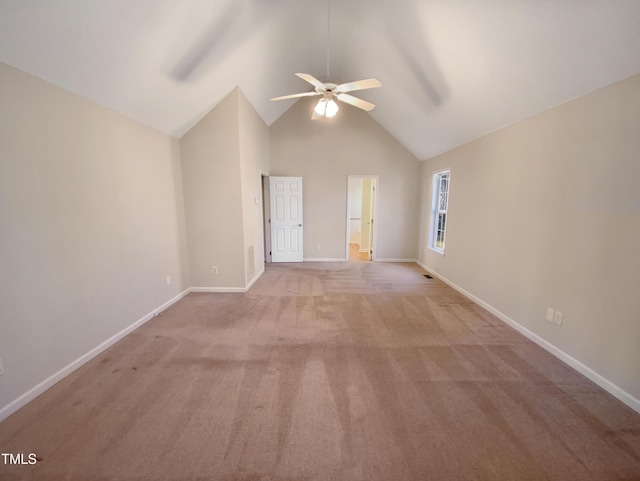 unfurnished room featuring light carpet, high vaulted ceiling, baseboards, and ceiling fan