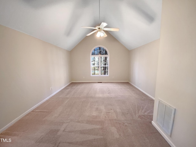 unfurnished room with carpet, baseboards, visible vents, lofted ceiling, and ceiling fan