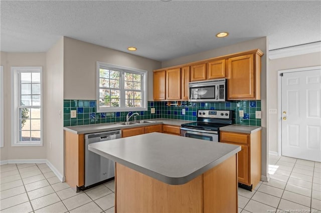 kitchen with light tile patterned floors, plenty of natural light, stainless steel appliances, and tasteful backsplash