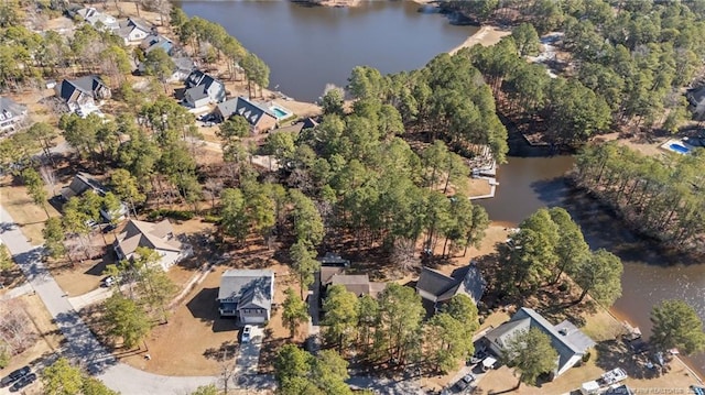 drone / aerial view with a water view and a residential view