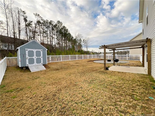 view of yard featuring a patio, a shed, a fenced backyard, a pergola, and an outdoor structure