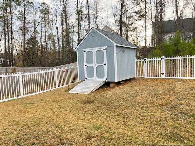 view of shed featuring a fenced backyard