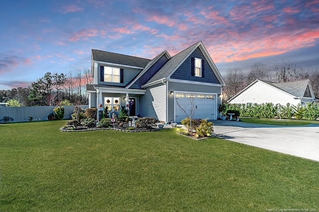 view of front of home with a garage, a lawn, concrete driveway, and fence