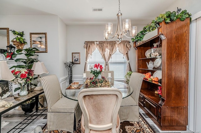 dining room with a notable chandelier and visible vents