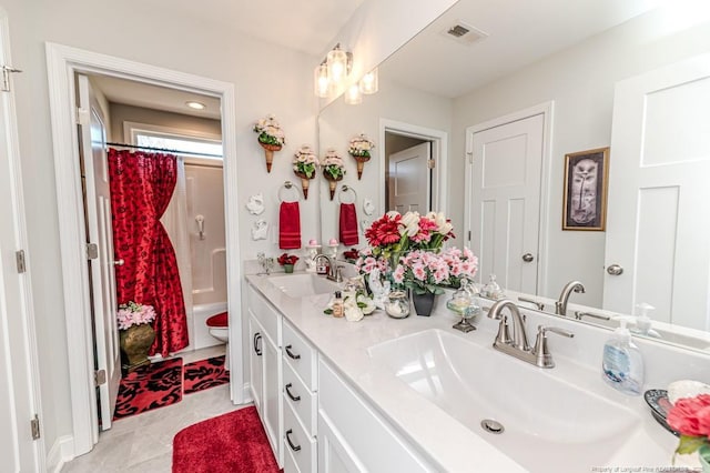 bathroom featuring double vanity, visible vents, toilet, and a sink