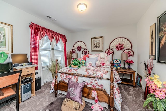 bedroom with visible vents and carpet