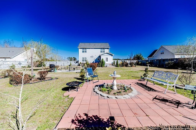 view of patio / terrace with a fire pit and fence