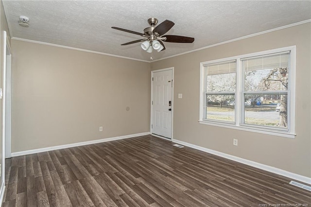 empty room with dark wood-style floors and crown molding