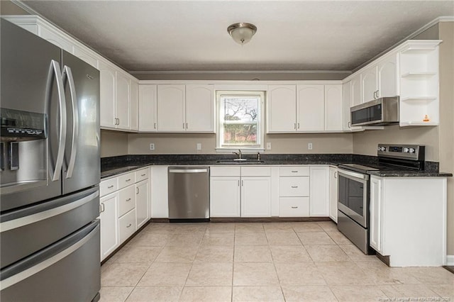 kitchen with a sink, open shelves, white cabinetry, stainless steel appliances, and light tile patterned flooring