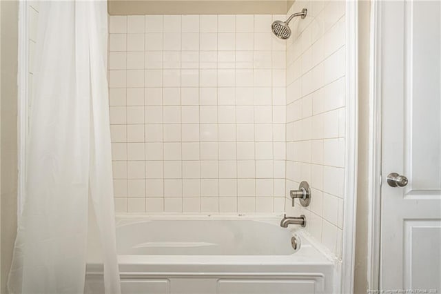 bathroom with shower / bath combination with curtain