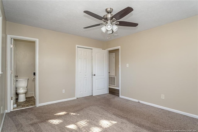 unfurnished bedroom featuring carpet, visible vents, a closet, and baseboards